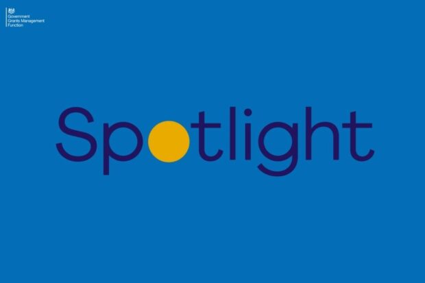 Word Spotlight on a blue background. The o of Spotlight in yellow.